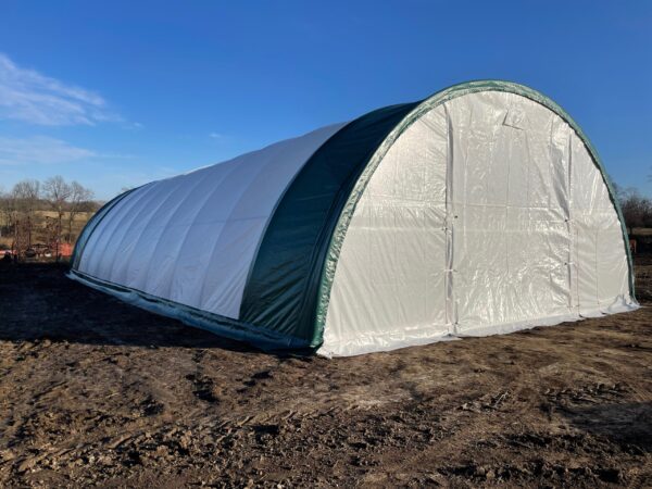 Example of 30 feet wide by 65 feet long gold mountain hoop shed installed on customer's farm.