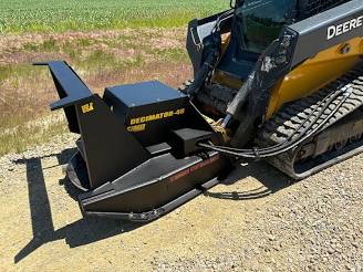Black Decimator-48 forestry disc mulcher attachment mounted on a skid steer, with a rugged design for efficient land clearing and mulching.