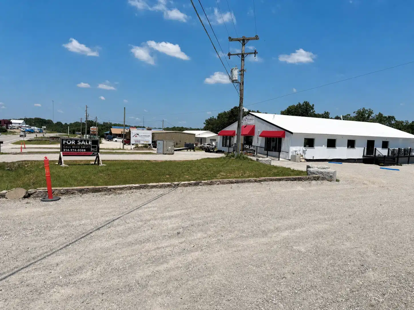 Wide exterior view of the commercial property at 706 N Main Street in Gravois Mills, Missouri.