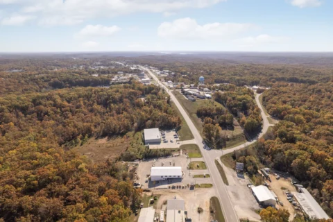 Wide aerial view of the property beside the road leading toward Gravois Mills.