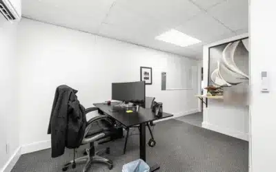 Office with desk, seating and a built-in counter.