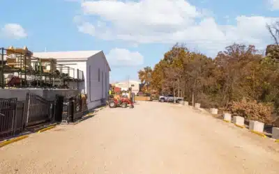 Gravel drive running along the side and rear of the building.