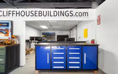 Interior counter opening toward a work area with desks and an overhead door.
