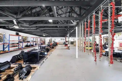 Showroom display area with hanging chains and equipment displays.