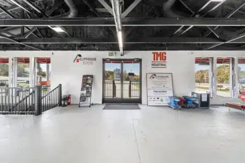 Interior view of the front entrance, windows and stair railing.