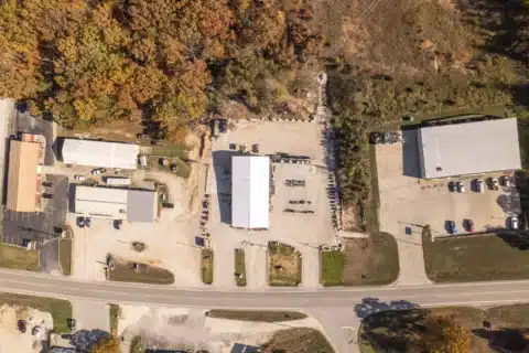 Top-down aerial view of the building, yard and road frontage at 706 N Main St.
