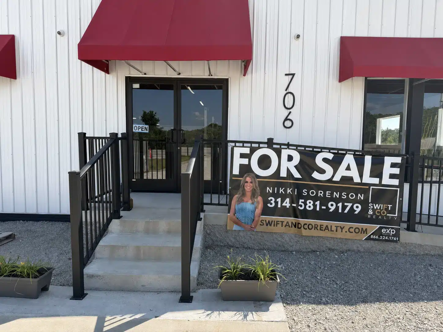 Main entrance at 706 N Main Street with a for sale sign for Nikki Sorenson of Swift and Company Realty.