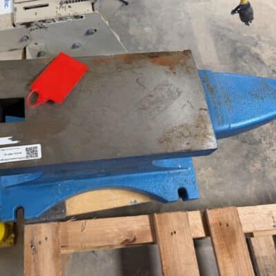 Skid steer excavator bucket attachment with blue steel body and work-ready cutting edge on display