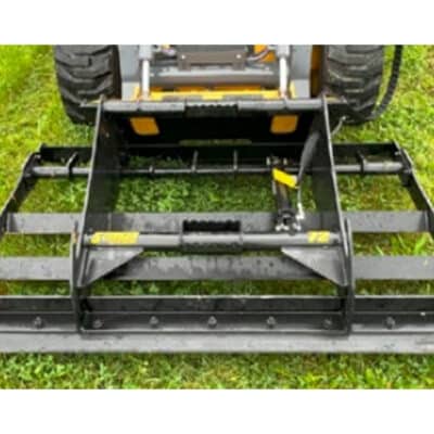 Stinger LP land plane grading attachment mounted on a skid steer