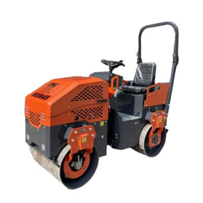 Orange road roller/compactor with two rollers and an elevated operator seat, used for asphalt compaction.