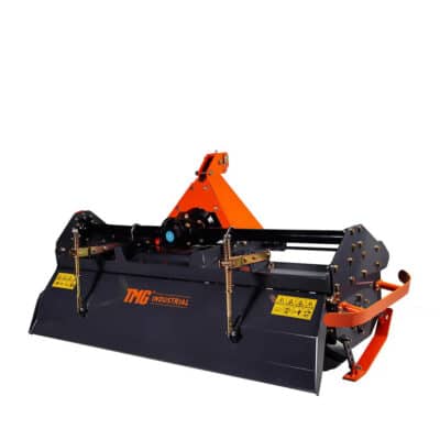 Tractor-mounted brush cutter attachment with orange frame and black housing by TMG Industrial.