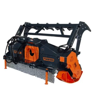 Heavy industrial mulcher attachment with orange housing and rotating teeth, used for grinding vegetation (model TMB890).